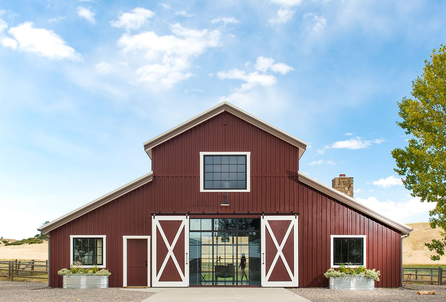 Steel residential storefront window wall in a barn