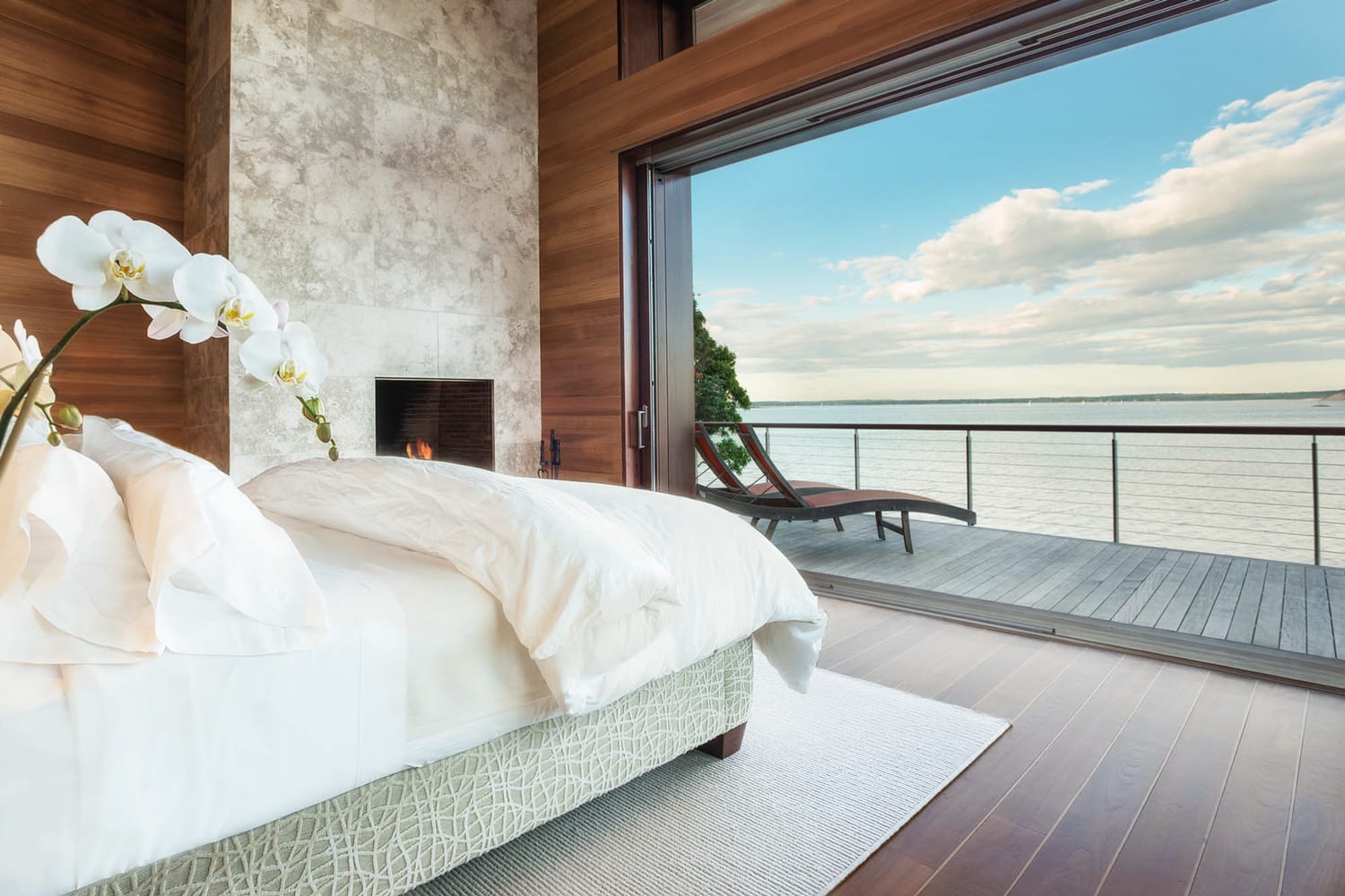 Pocketing lift and slide doors overlooking the harbour from a bedroom