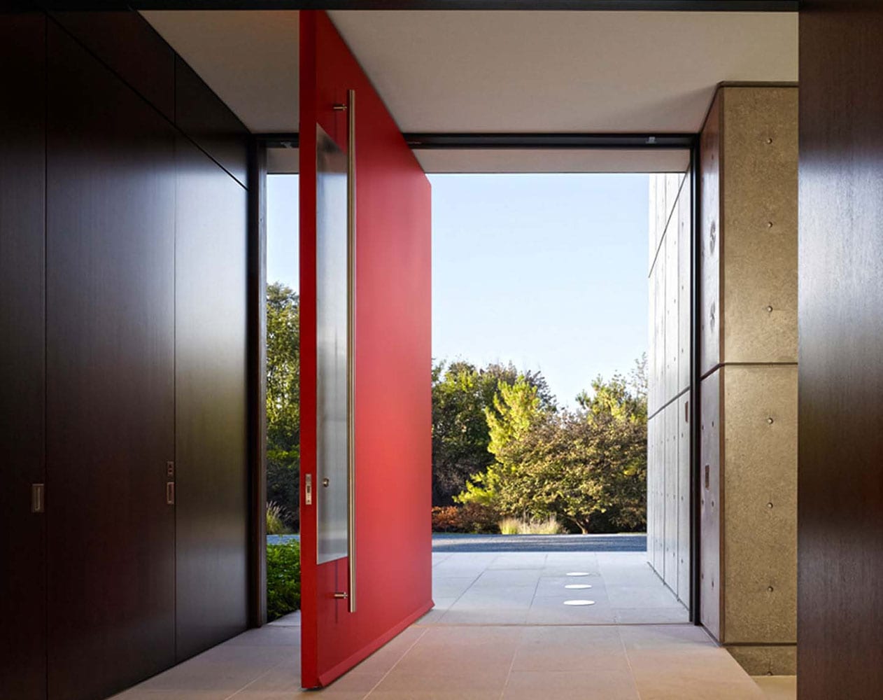 Massive wood pivot modern entryway