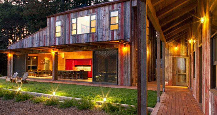 Modern rustic farmhouse at night